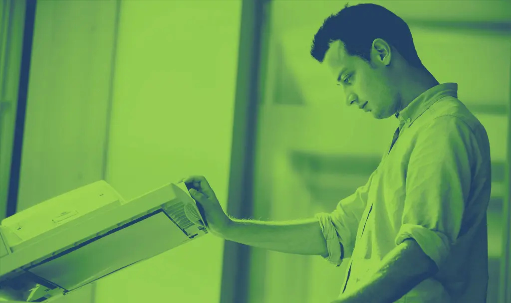 A man holding onto the handle of a box.